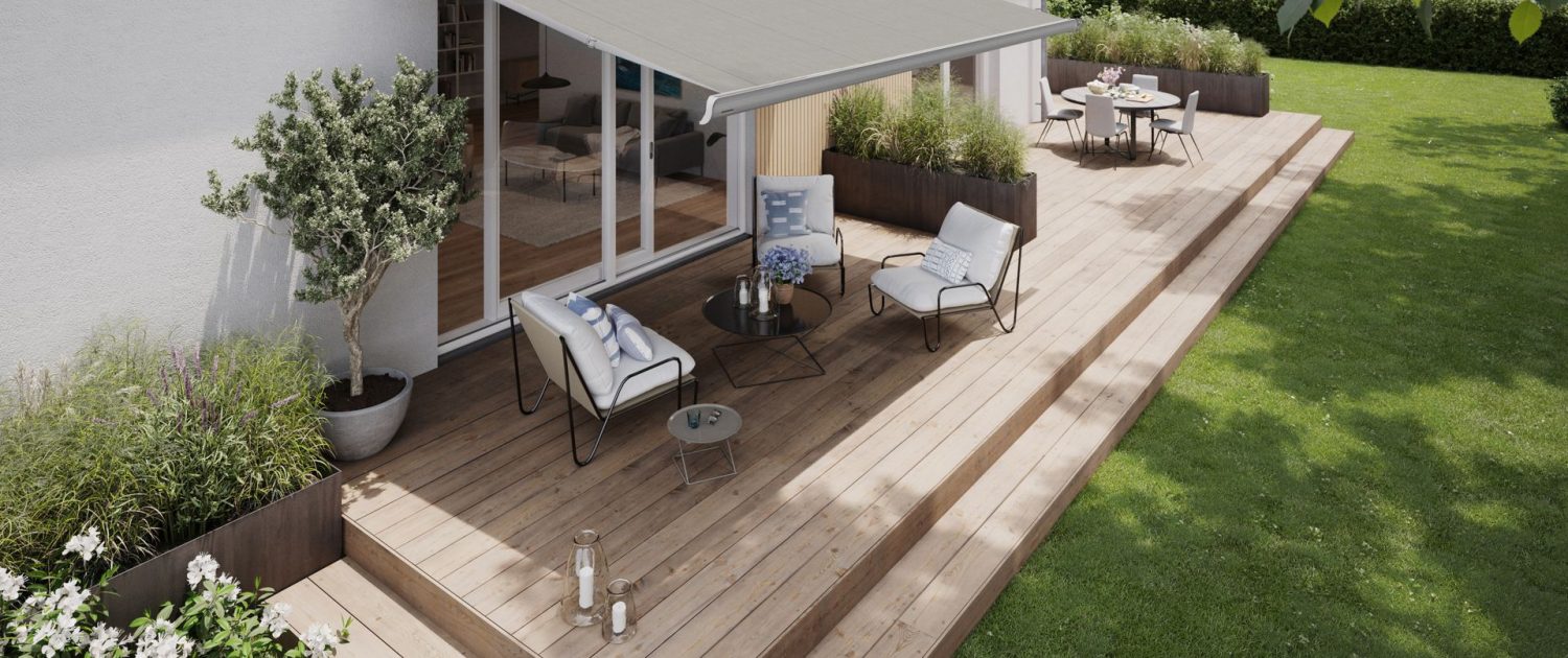 markilux-mx-2-med-tofarvet-kassette-i-gra-og-solv-med-grat-stof-over-en-terrasse