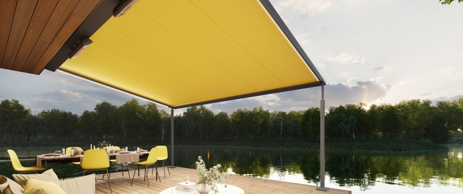 markilux-pergola-cubic-med-gul-dug-belysning-og-varmeapparater-pa-en-terrasse-ved-soen